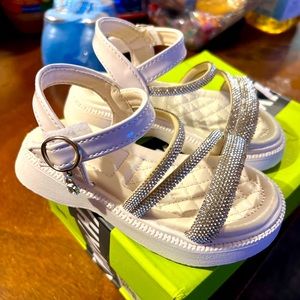 White sandals (with charms that hang.)